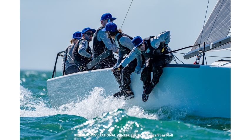 Laura Grondin and Taylor Canfield sitting in the cockpit racing Dark Horse USA864 at the Bacardi Invitational Winter Series 2024