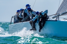 Laura Grondin and Taylor Canfield sitting in the cockpit racing Dark Energy USA864 at the Bacardi Invitational Winter Series 2024